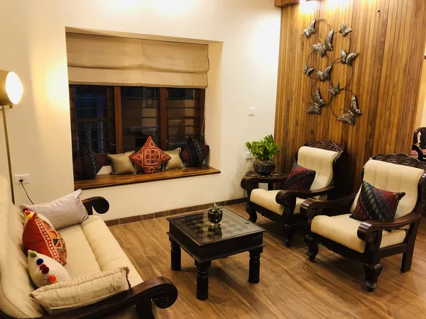 Living room with window seat and teak panelling